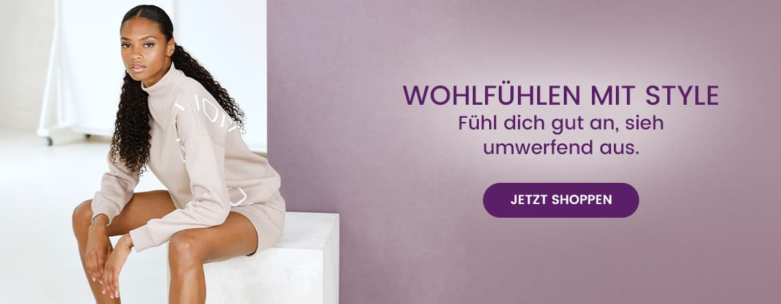 WOHLFÜHLEN MIT STYLE – Frau in beigem Sweatshirt und Shorts sitzt auf weißem Block, Text: Fühl dich gut an, sieh umwerfend aus.