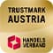 Trustmark Austria – Logo des Handelsverbands mit rotem Symbol auf goldenem Hintergrund